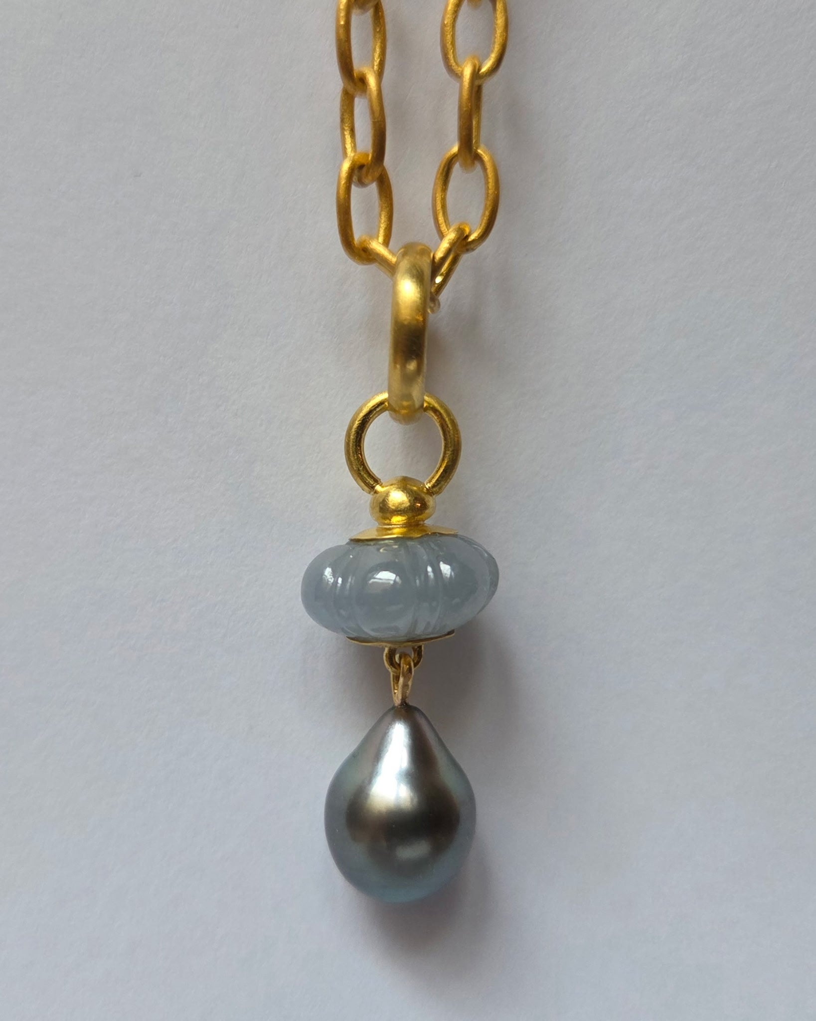 “Lure III” Gold, Carved Sapphire and Tahitian Pearl Pendant